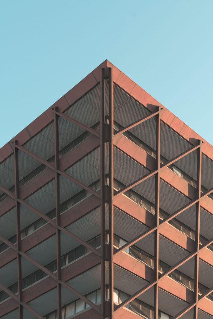low angle shot modern building middle city clear sky